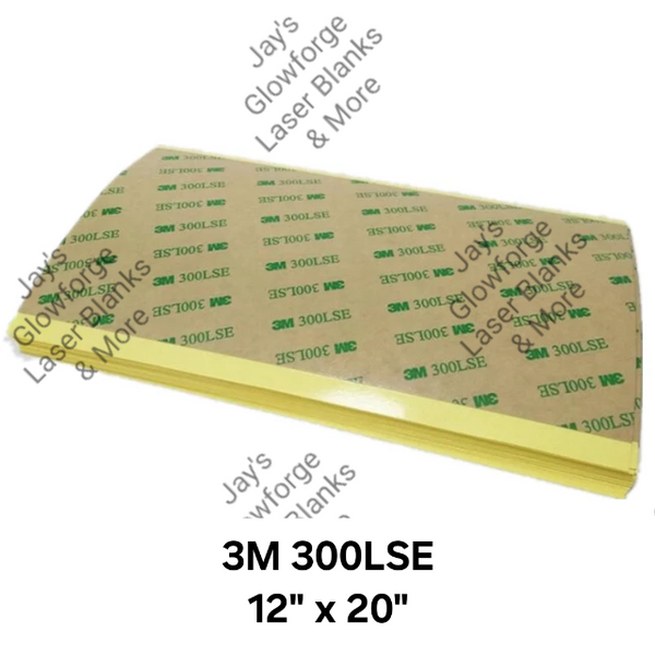 Stack of 3M 300LSE adhesive sheets with visible branding and measurements (12" x 20") on a white background.